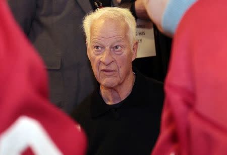 Former Detroit Red Wings player Gordie Howe signs autographs for fans in celebration of his 85th birthday before the start of the Red Wing's NHL hockey game against the Chicago Blackhawks in Detroit, Michigan, United States on March 31, 2013. REUTERS/ Rebecca Cook/File Photo