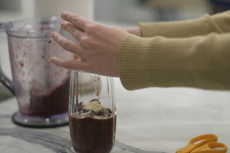 In this Jan. 10, 2020 image from video, 18 year old Nina Nichols pours her dose of Palforzia into a smoothie in her home in Washington. Developed by Aimmune Therapeutics, Palforzia is a powder mixed into food and taken daily containing peanut protein, designed to gradually train the bodies of children and teens with peanut allergy to better tolerate an accidental bite of the forbidden food. On Friday, Jan. 30, 2020, the Food and Drug Administration approved Palforzia, the first treatment for peanut allergies in a big step toward better care for all kinds of food allergies -- but still a long way from a cure. (AP Photo/Federica Narancio)