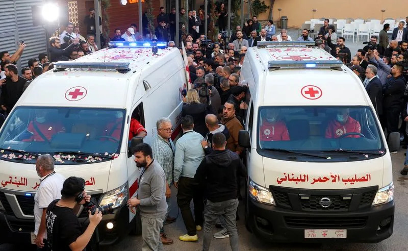 Ambulances carrying the bodies of the two journalists of Lebanon-based Al Mayadeen TV channel are parked outside the channel's building in Beirut