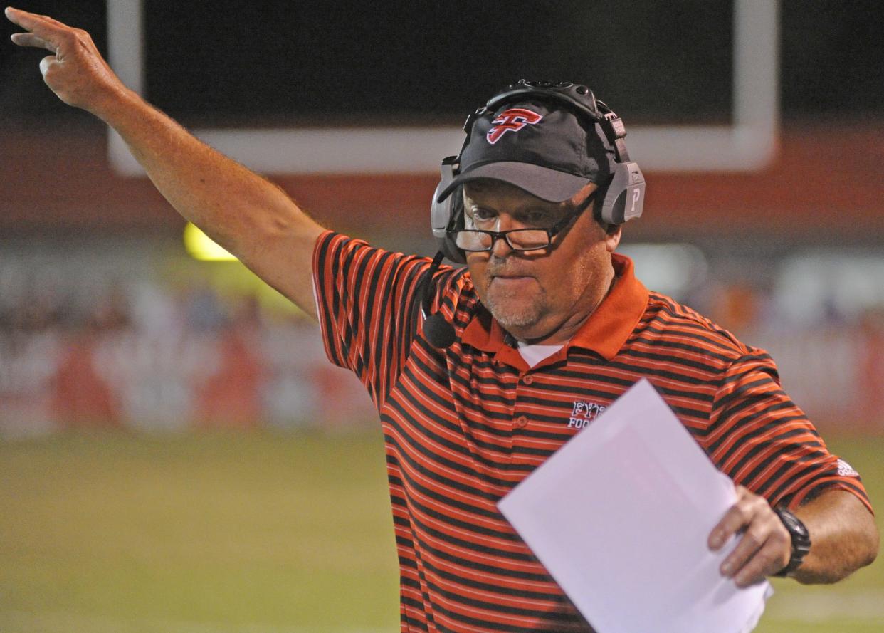 Fyffe coach Paul Benefield gives instructions against Collinsville last season at Long-Ridgeway Stadium in Fyffe.