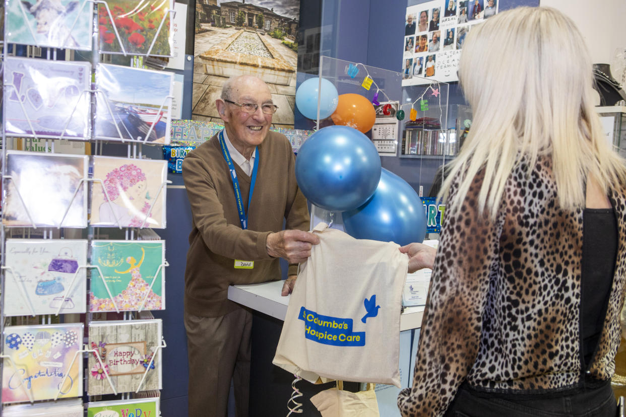 The 99-year-old loves chatting to customers in the shop. (SWNS)