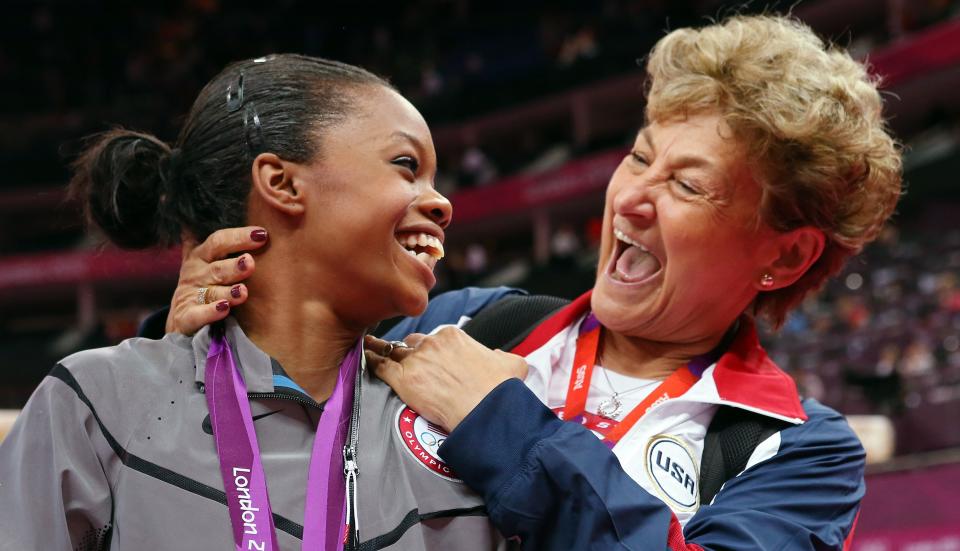 Martha Karolyi, right, with gymnast Gabby Douglas on Day 6 of the 2012 Olympics in London. (Photo: Ronald Martinez/Getty Images)