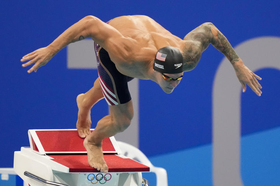 FILE - Caeleb Dressel starts the men's 50-meter freestyle final at the 2020 Summer Olympics, Sunday, Aug. 1, 2021, in Tokyo. Dressel didn't qualify for the biggest swim meet of the year. Some of the world's greatest swimmers will miss the world championships as they deal with burnout and the enormous toll that their sport takes on their minds and bodies. (AP Photo/David Goldman, File)