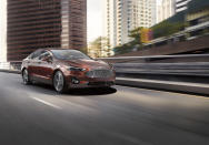 This undated photo provided by Ford shows the 2020 Ford Fusion Hybrid, a midsize sedan with an EPA-estimated 43 mpg in city driving. (Kevin Pearce/Ford Motor Co. via AP)