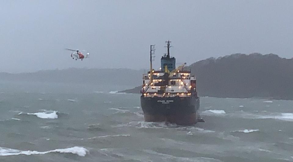 The Coastguard helicopter flew in to aid the ship's recovery (@NDK72/Twitter)