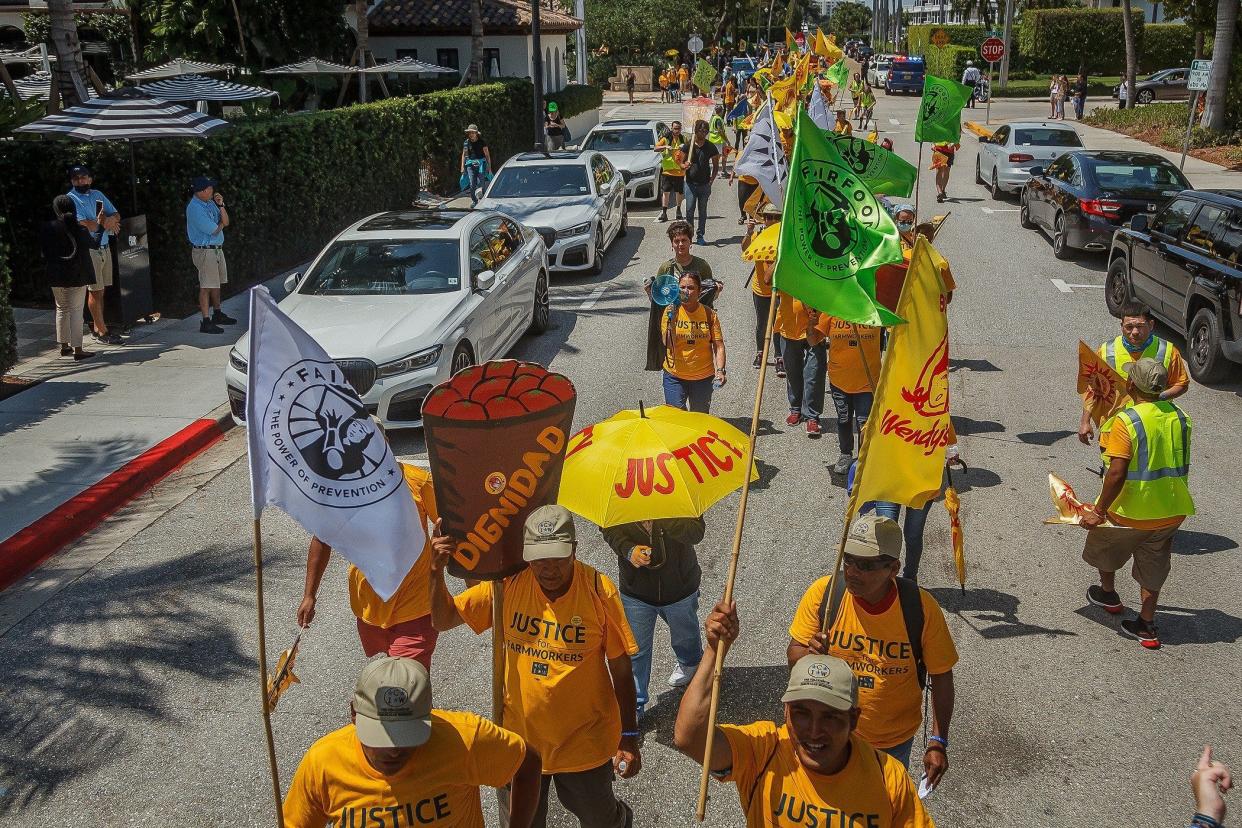 Farmworkers and their supporters march through Palm Beach on April 2, 2022 with a message to boycott Wendy's restaurants for its failure to participate in the Fair Food Program.