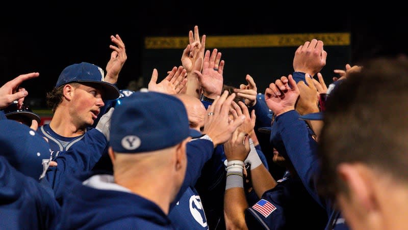 Brigham Young Cougars celebrate after their victory against the Utah Utes during a college baseball game at Smith's Ballpark in Salt Lake City on Tuesday, April 9, 2024.