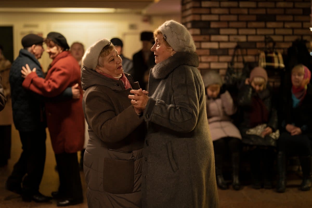 Ukraine’s border crossings are still lined with posters warning female refugees of the dangers they could face (AP)