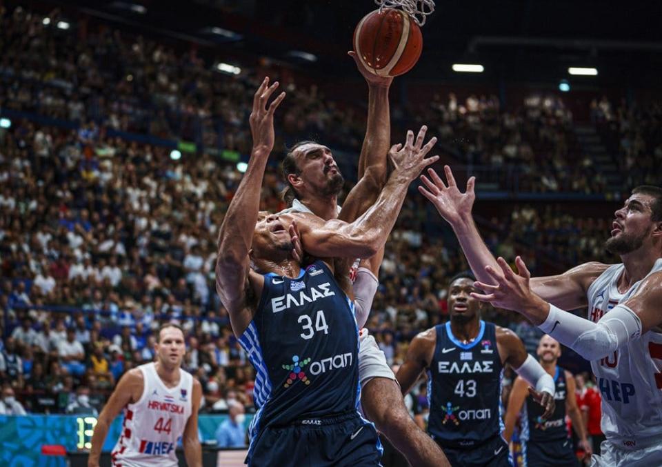 Dario Saric battles Giannis Antetokounmpo in Croatia's matchup versus Greece in EuroBasket play in Milan, Italy.