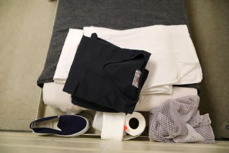 Possessions lie on a bed in a women's dormitory at the Adelanto immigration detention center, which is run by the Geo Group Inc (GEO.N), in Adelanto, California, U.S., April 13, 2017. REUTERS/Lucy Nicholson