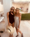 <p>The gorgeous blonde had a quick outfit change and wore a stunning black one-piece, paired with a big floppy hat and oversized black sunglasses. The bride posed with friend Caroline Matson. Source: Instagram/annaheinrich1 </p>