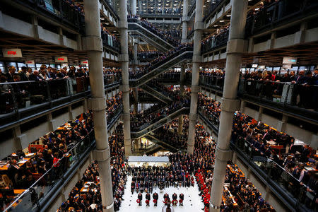 FILE PHOTO: Lloyd's of London staff hold their annual Remembrance Day service at the Lloyd's building in the City of London, Britain November 11, 2015. REUTERS/Stefan Wermuth/File Photo