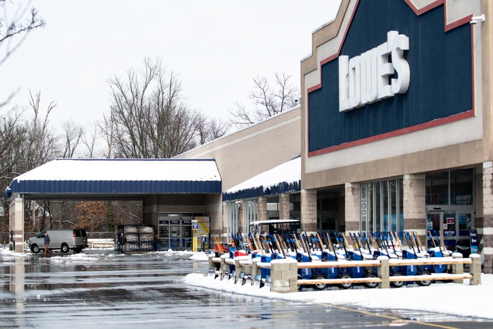 Customers leave Lowe's, in Warrington, after a storm dropped several inches of heavy snow throughout Bucks County and the surrounding region Tuesday, February, 13, 2024.