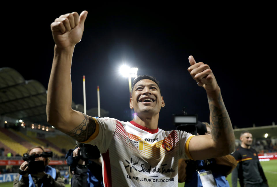 Catalans Dragons Israel Folau gestures to the crowd after the Super League rugby match between Catalans Dragons and Castleford Tigers at Stade Gilbert Brutus in Perpignan, France, Saturday, Feb. 15, 2020. (AP Photo/Joan Monfort)