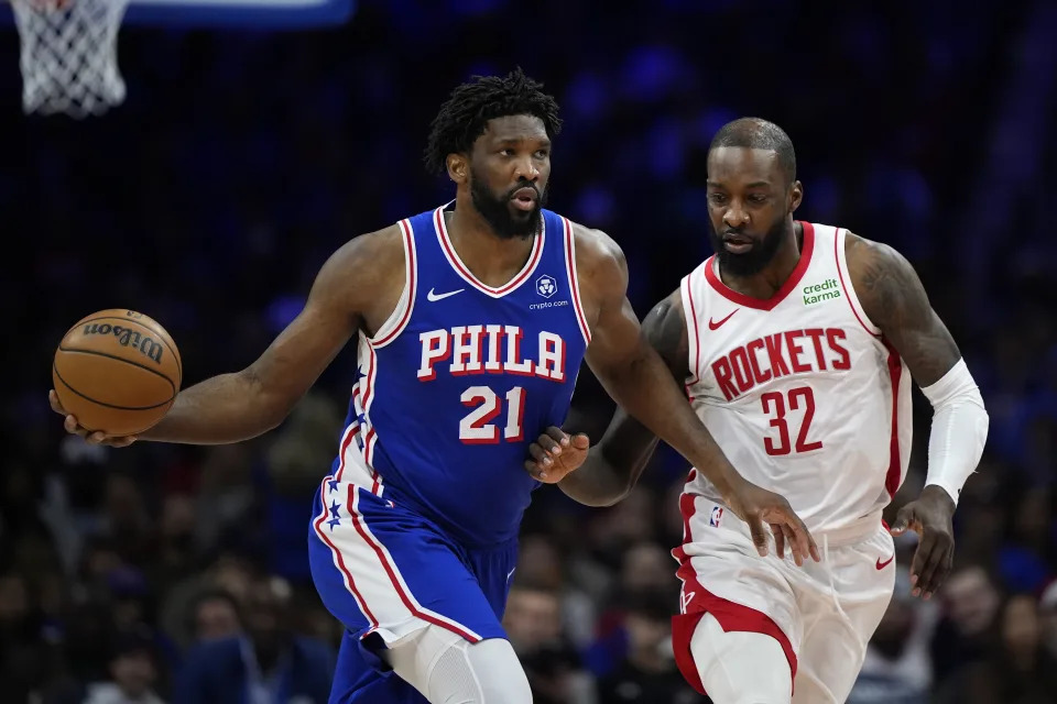 Philadelphia 76ers' Joel Embiid, left, tries to get past Houston Rockets' Jeff Green during the first half of an NBA basketball game, Monday, Jan. 15, 2024, in Philadelphia. (AP Photo/Matt Slocum)