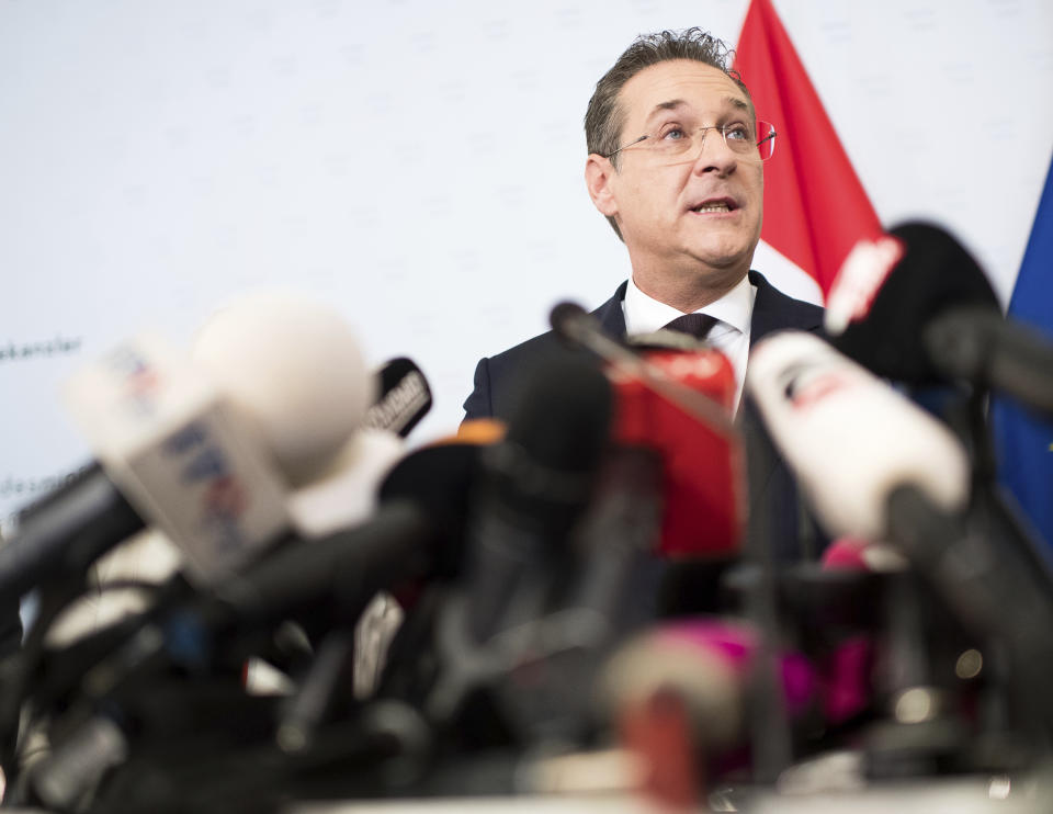 Austrian Vice Chancellor Heinz-Christian Strache (Austrian Freedom Party), center, addresses the media during press conference at the sport ministry in Vienna, Austria, Saturday, May 18, 2019. Strache says he is resigning after two German newspapers published footage of him apparently offering lucrative government contracts to a potential Russian benefactor. (AP Photo/Michael Gruber)