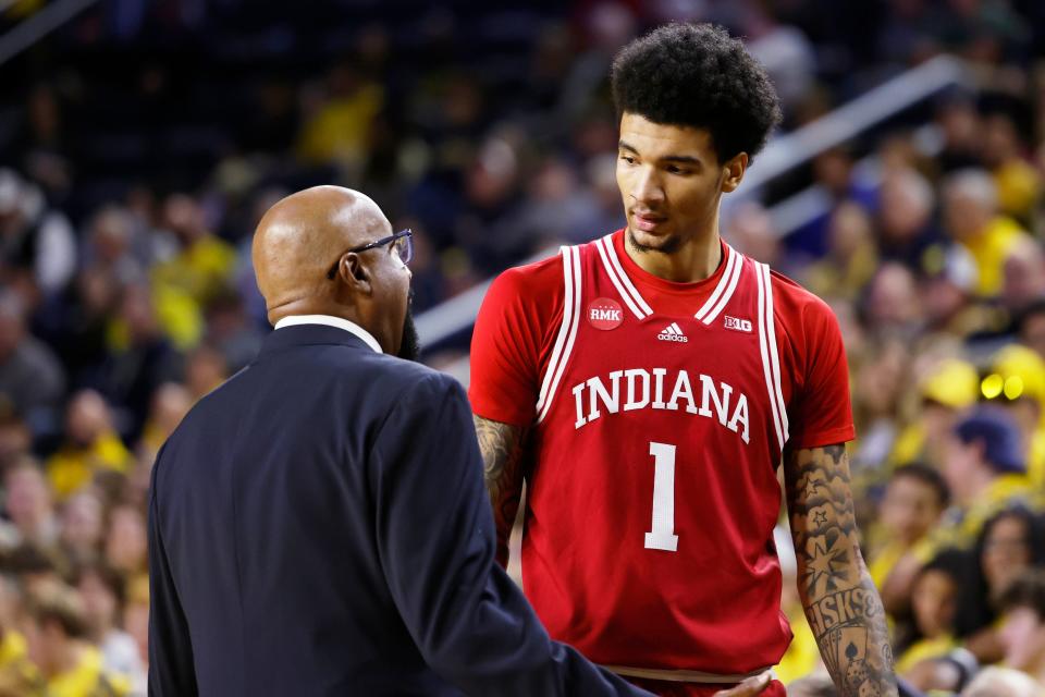 Dec 5, 2023; Ann Arbor, Michigan, USA; Indiana Hoosiers head coach Mike Woodson talks to Indiana Hoosiers center Kel'el Ware (1) in the first half against the Michigan Wolverines at Crisler Center. Mandatory Credit: Rick Osentoski-USA TODAY Sports