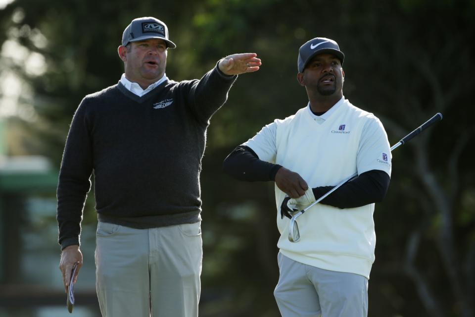 PEBBLE BEACH, CALIFORNIA - FEBRUARY 07:  Jason Gore of the United States and Alfonso Ribeiro talk during the first round of the AT&T Pebble Beach Pro-Am at Monterey Peninsula Country Club Shore Course on February 07, 2019 in Pebble Beach, California. (Photo by Jeff Gross/Getty Images)