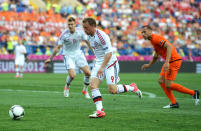 KHARKOV, UKRAINE - JUNE 09: Michael Krohn-Dehli of Denmark breaks through to score their first goal during the UEFA EURO 2012 group B match between Netherlands and Denmark at Metalist Stadium on June 9, 2012 in Kharkov, Ukraine. (Photo by Lars Baron/Getty Images)