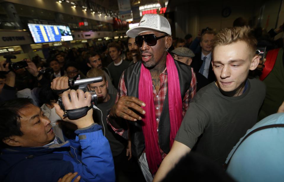 Former NBA basketball player Rodman is surrounded by journalists as he arrives at the Beijing Capital International Airport to leave for Pyongyang, in Beijing