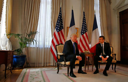 U.S. President Donald Trump (L) meets French President Emmanuel Macron before a working lunch ahead of a NATO Summit in Brussels, Belgium, May 25, 2017. REUTERS/Peter Dejong/Pool