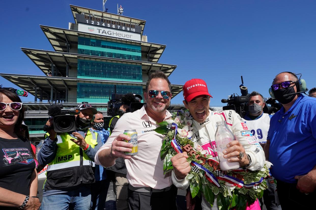 Helio Castroneves and team co-owner Mike Shank celebrate Castroneves' fourth Indianapolis 500 win in 2021.