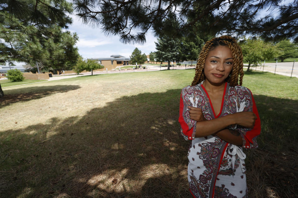 Tiera Brown stands outside Montbello High School in northeast Denver on June 22, 2020. Brown, 28, who supported Denver schools’ decision to phase out officers, wonders if there would be more fellow Black students in her University of Denver law class if they had been treated with more understanding as young students. (AP Photo/David Zalubowski)