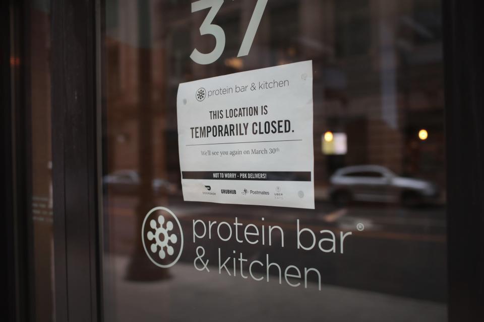 A sign hangs on the door of a shuttered restaurant in the Chicago Loop on March 19, 2020 in Chicago, Illinois. Restaurants, bars, and many other businesses are closed in the Loop and many office buildings are virtually deserted as companies have ordered their employees to work from home to avoid the spread of COVID-19.