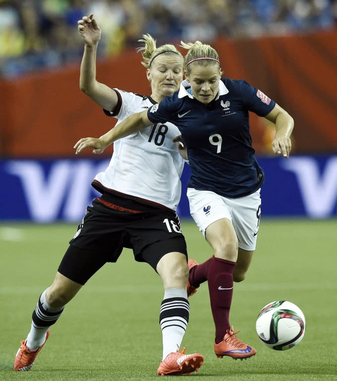 Germany's Alexandra Popp (L) fights for the ball with France's Eugenie Le Sommer during their FIFA Women's World Cup quarter-final match, at the Olympic Stadium in Montreal, Canada, on June 26, 2015