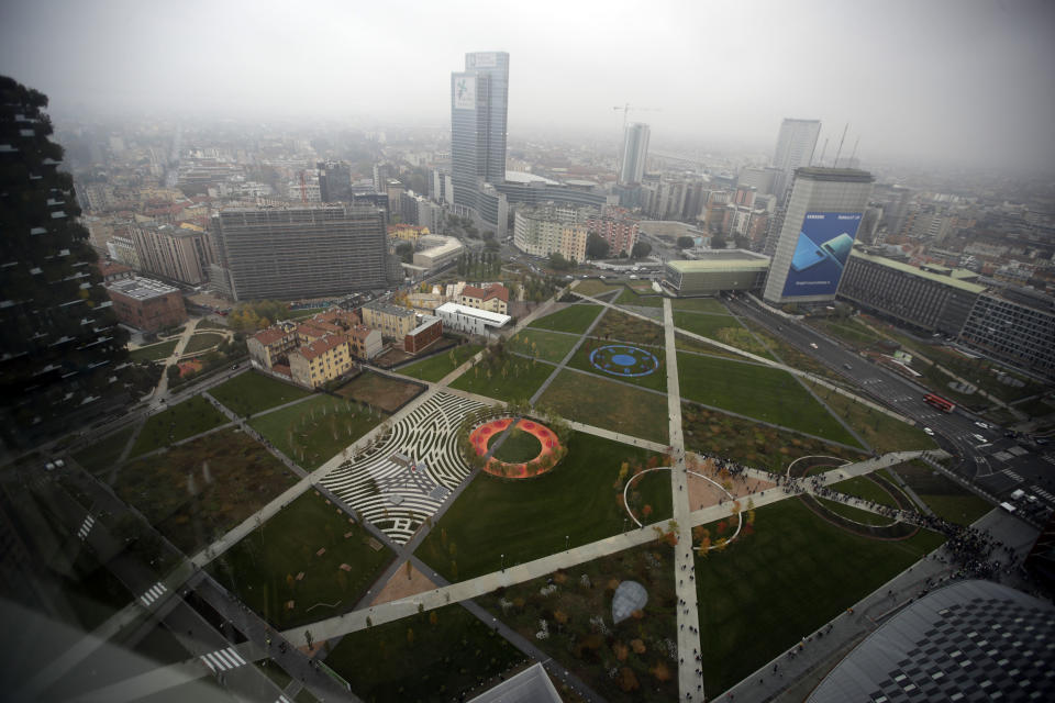 In this picture taken on Saturday, Oct. 27, 2018 an aerial view of the 'Tree Library' park, in Milan, Italy. If Italy's fashion capital has a predominant color, it is gray not only because of the blocks of uninterrupted neoclassical stone buildings for which the city is celebrated, but also due to the often-gray sky that traps in pollution. The city has ambitious plans to plant 3 million new trees by 2030_ a move that experts say could offer relief to the city’s muggy and sometimes tropical weather. (AP Photo/Luca Bruno)