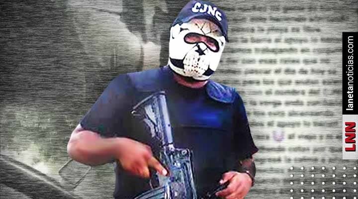 A member of Mexican super cartel CJNG wears a death mask and shows off his gun.