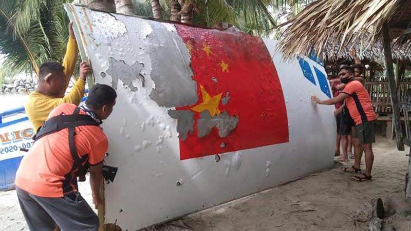 The Philippine Coast Guard inspecting debris from a Long March 5B rocket launched on July 24, 2022.