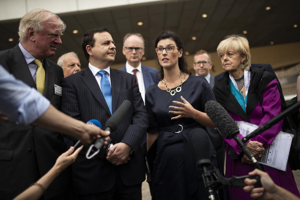 British lawmaker Layla Moran, second right, along with a cross-party delegation of British parliamentarians talk to journalists after meeting European Union chief Brexit negotiator Michel Barnier at the European Commission headquarters in Brussels, Friday, July 19, 2019. (AP Photo/Francisco Seco)