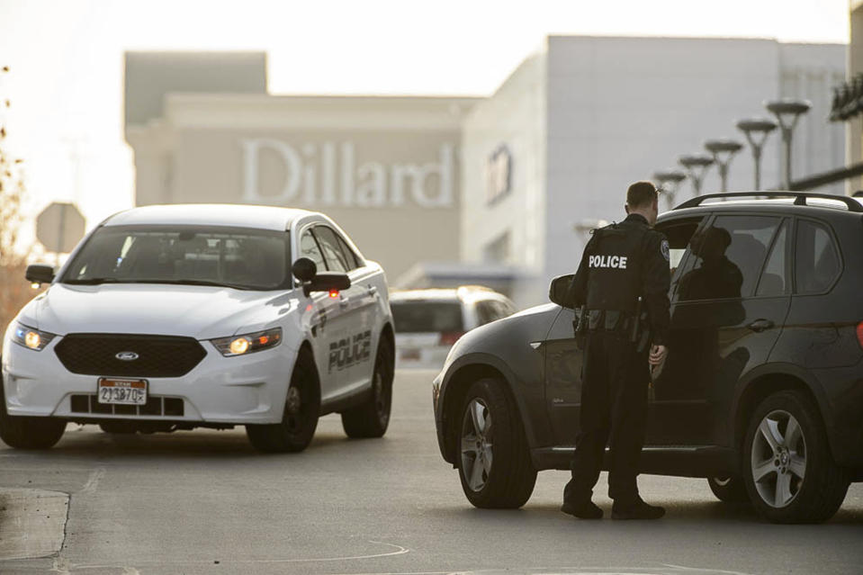 Police escort employees from Dillard's out of the Fashion Place mall after a shooting in Murray, Utah, Sunday, Jan. 13, 2019. (Francisco Kjolseth/The Salt Lake Tribune via AP)