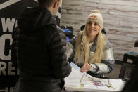 Skier Lindsey Vonn sign autographs at the grand opening of Big Snow in East Rutherford, N.J., Thursday, Dec. 5, 2019. The facility, which is part of the American Dream mega-mall, is North America's first indoor ski and snowboard slope with real snow. (AP Photo/Seth Wenig)