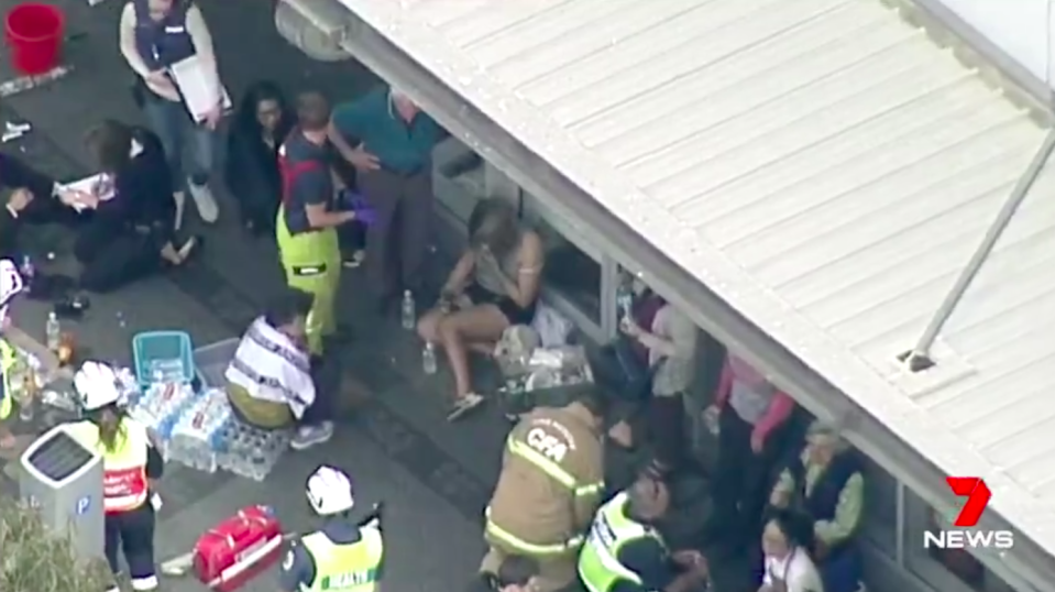 Outside the bank, dozens of customers and staff were treated for burns. Source: 7News