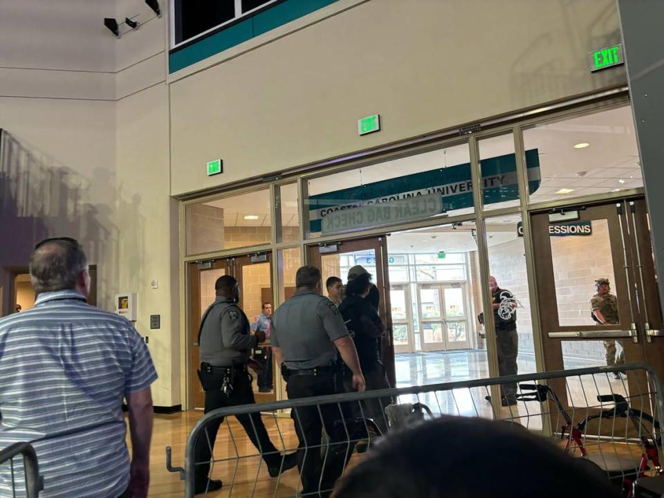 Security escorts protesters out of the HTC Center at Coastal Carolina University during former President Donald Trump’s rally on Saturday, Feb. 10, 2024. Emalyn Muzzy/emuzzy@thesunnews.com