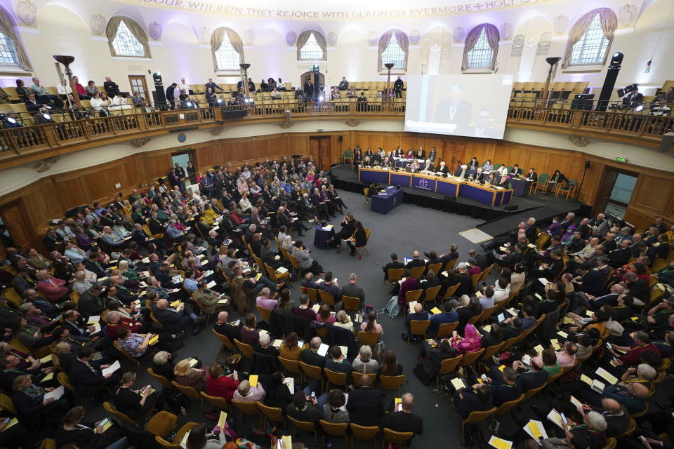 Members of the Church of England's Synod, gather at the General Synod of the Church of England, at Church House in central London, to consider a motion which reviews the church's failure "to be welcoming to LGBTQI+ people" and the harm they have faced and still experience, in London, Thursday, Feb. 9, 2023. (James Manning/PA via AP)