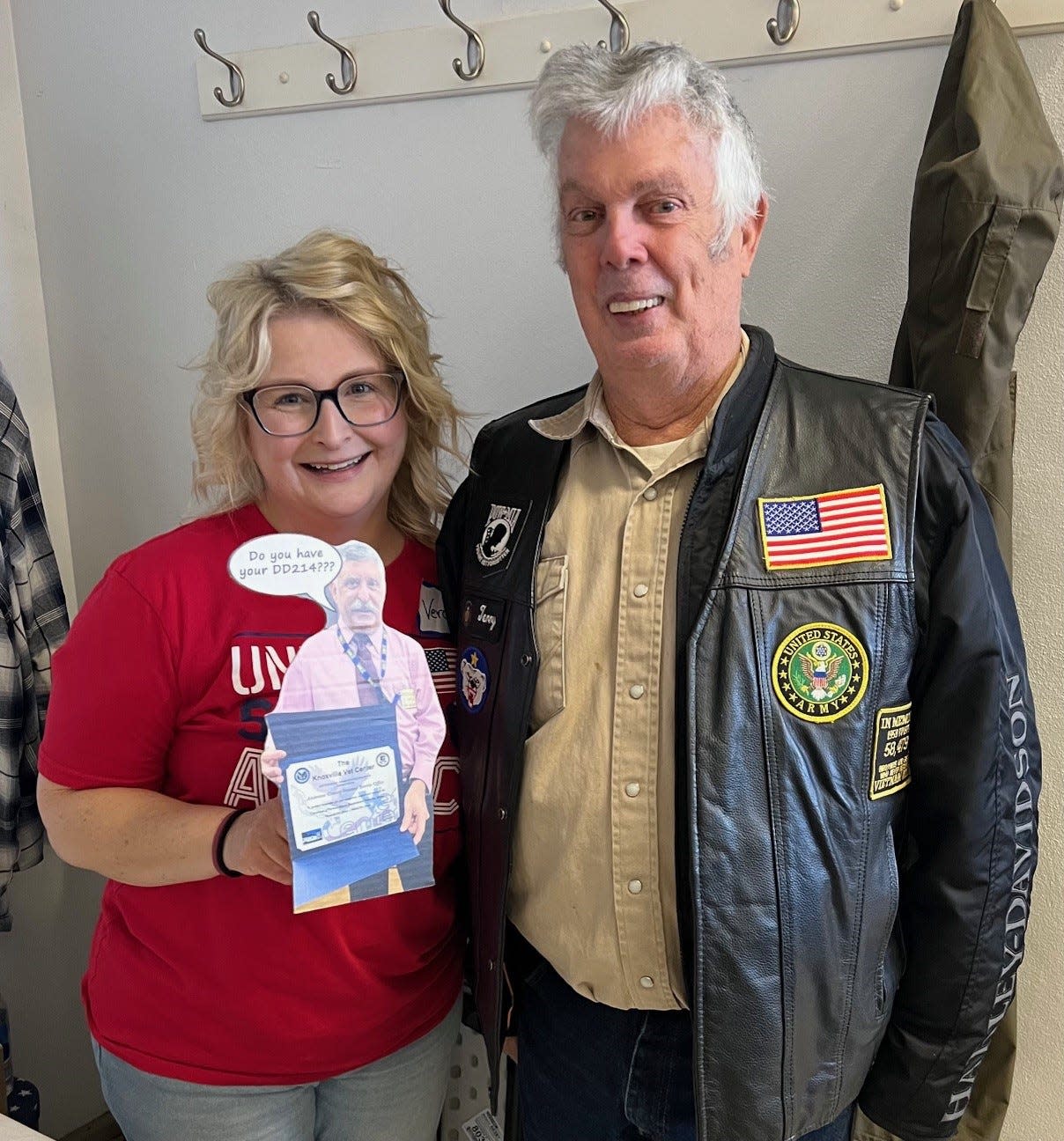 Breakfast volunteer Veronica Huff and veteran Terry Shores pose with a cardboard cutout reminder of the most commonly asked question by retired Anderson County Veteran Service Officer Leon Jaquet: “Do you have your DD214?”