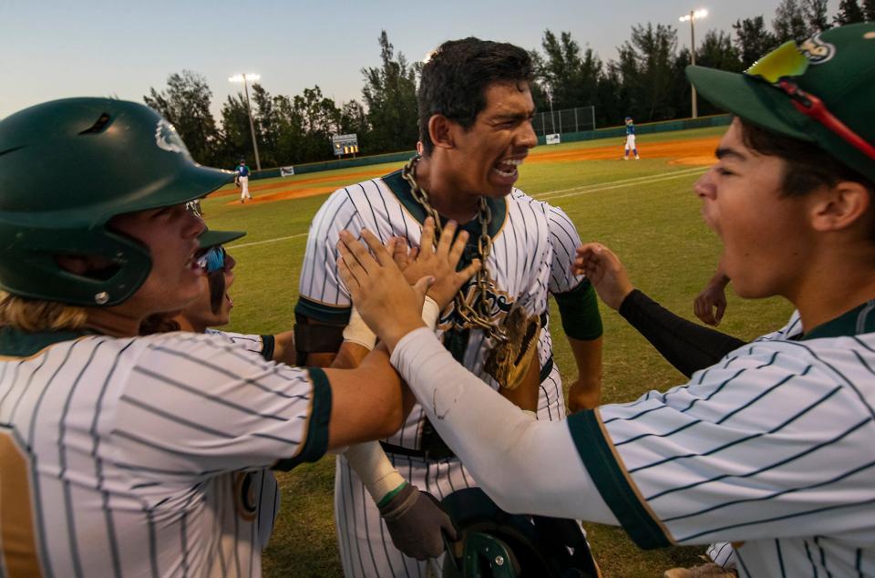 Island Coast's Emilio Gonzalez, celebrates after hitting a 2-run homer. Bonita Springs High School visited Island Coast for the Region 4A-4 Baseball quarterfinal matchup Wednesday, May 11, 2022 in Cape Coral. The Island Coast Gators defeated the bull sharks 10-0 and the game was called in the 5th inning.