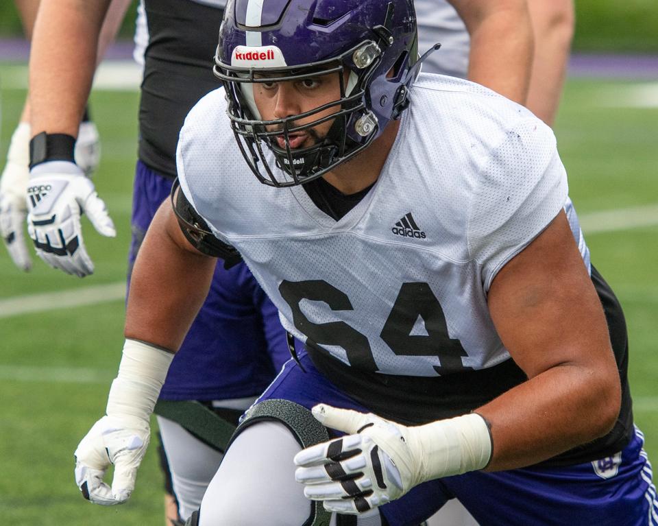 Holy Cross offensive lineman Eric Schon concentrates at practice Wednesday.