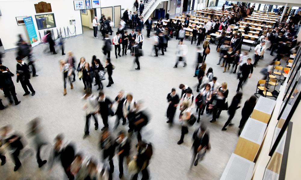 Pupils at Williamwood High School, Glasgow make their way to classes