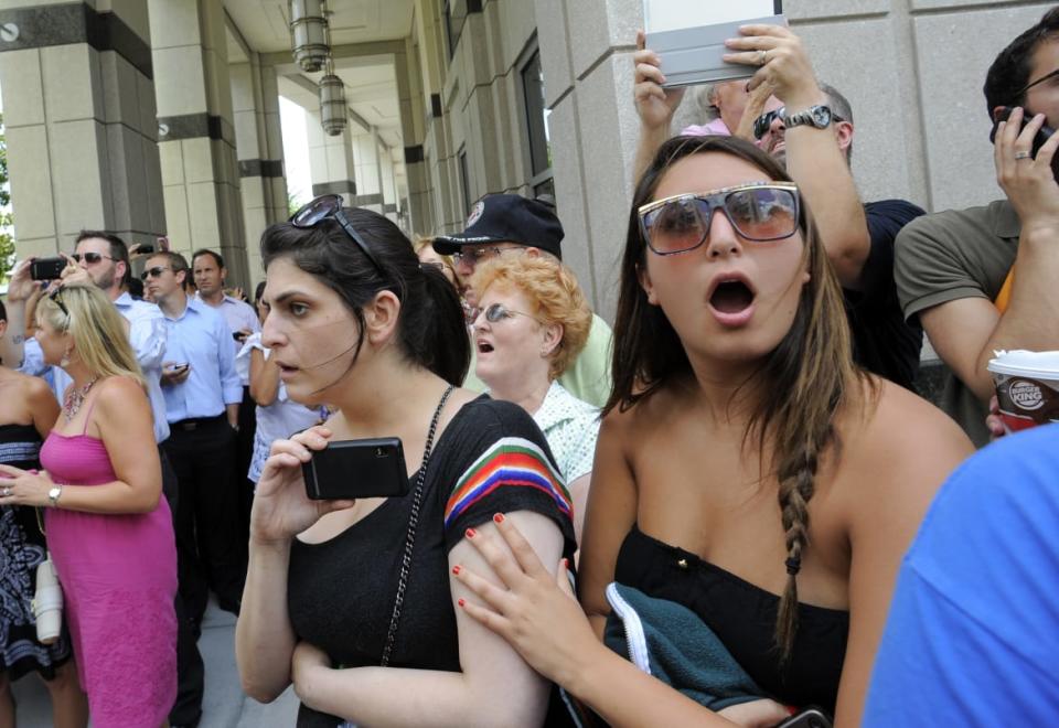 <div class="inline-image__caption"><p>People react outside court after hearing the jury’s verdict acquitting Casey Anthony of first-degree murder.</p></div> <div class="inline-image__credit">Reuters</div>