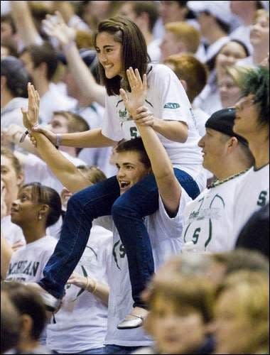 MSU alumni and former Izzone leader Adam Heins with his wife Lauren in the stands at Breslin during the 2008-2009 basketball season.