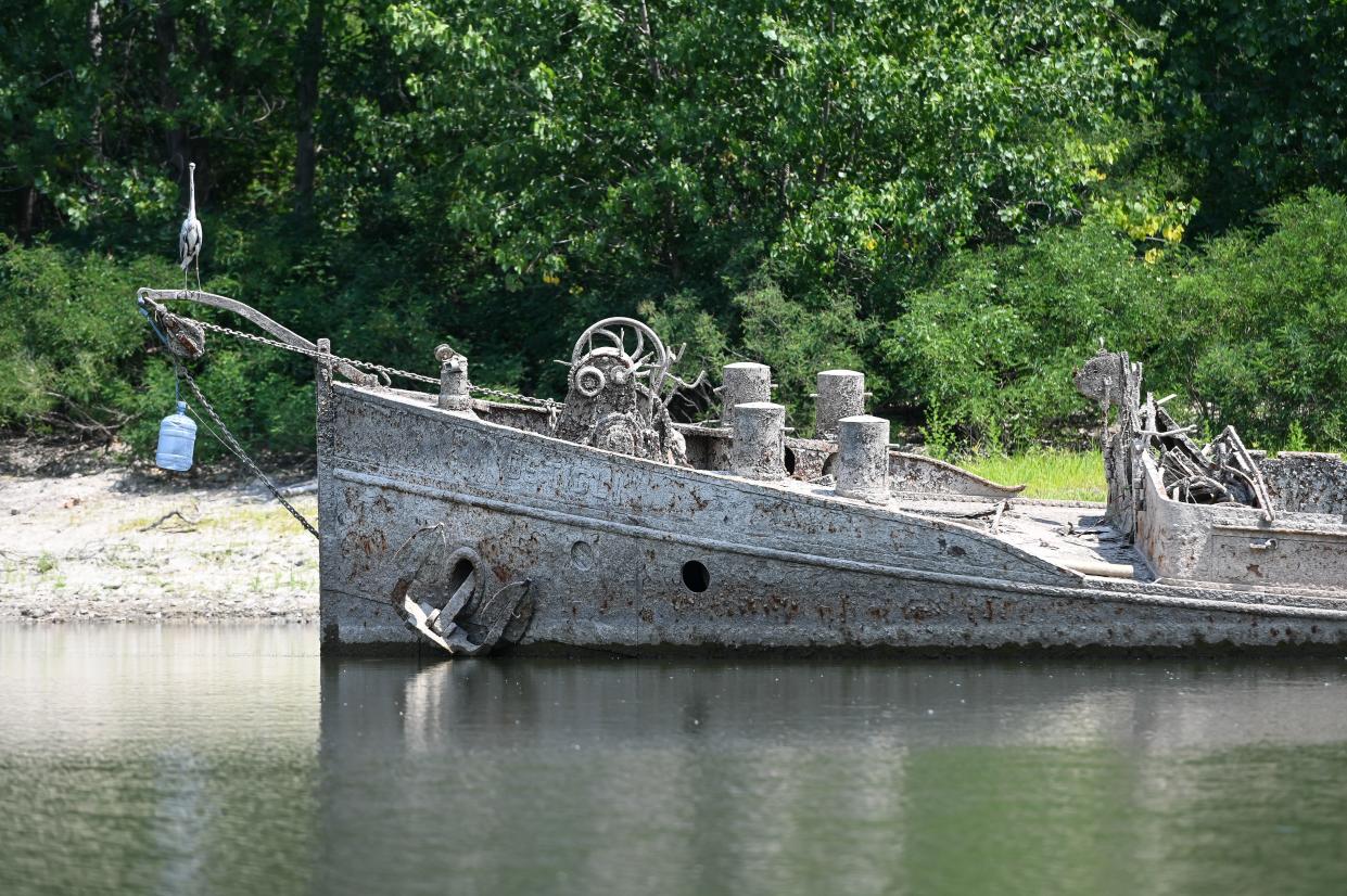 A heron stands on a large 55-meter barge that was sunk by WWII American bombing in 1944 while preventing retreat of the German army, that re-emerged due to severe drought from the River Po in Gualtieri, Italy on June 15, 2022. - According to the river observatory, the drought affecting Italy's longest river Po is the worst in the last 70 years. (Photo by Piero CRUCIATTI / AFP) (Photo by PIERO CRUCIATTI/AFP via Getty Images)