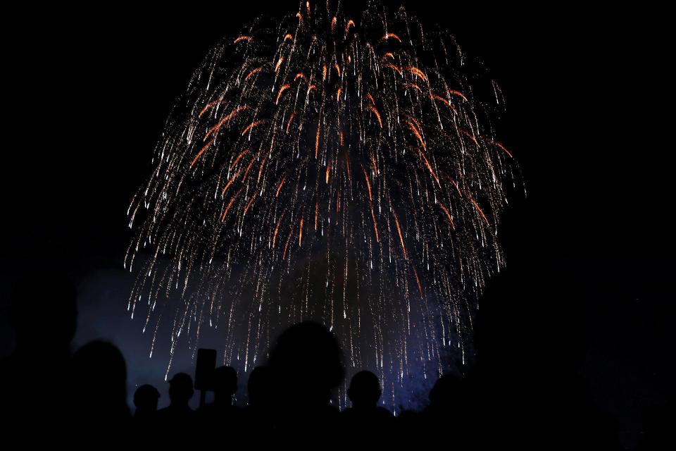 People watch fireworks over the Del Mar fair&nbsp;on Tuesday.