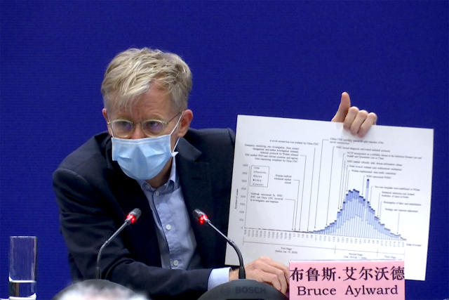 Dr. Bruce Aylward, an assistant director-general of the World Health Organization speaks with a chart during a press conference about China's response to the new COVID-19 coronavirus, in Beijing on Monday, Feb. 24, 2020.  (Sam McNeil/AP)