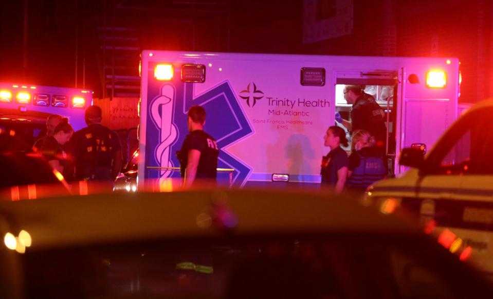 Emergency responders work after placing a patient in an ambulance as Wilmington police investigate a shooting on the 800 block of West Street reported about 11:15 p.m. Friday night.