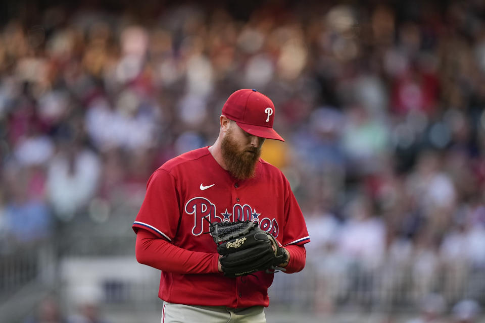 Philadelphia Phillies starting pitcher Dylan Covey is taken out of a baseball game in the first inning against the Atlanta Braves, Sunday, May 28, 2023, in Atlanta. (AP Photo/Brynn Anderson)