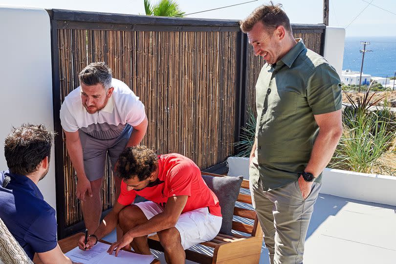 Julian Ward looks on as Mohamed Salah signs contract extension with Liverpool in 2022